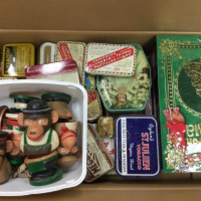 Two boxes containing various tins including OXO, Colmans Mustard etc, together with PG Tips Monkey Egg Cups