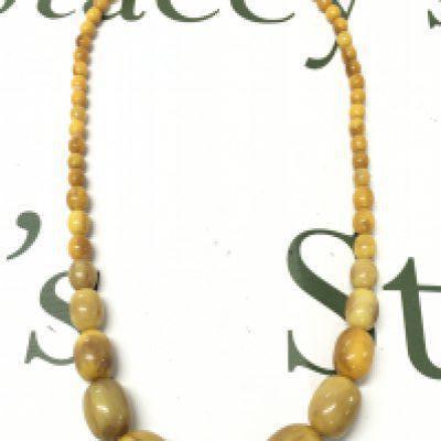 A Butterscotch Bakelite amber necklace  70cm, 70g total weight. Postage category A