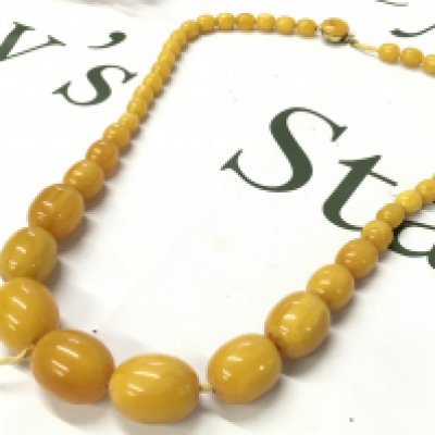 Butterscotch bakelite amber necklace , 70cm long 95g total weight. Postage category A