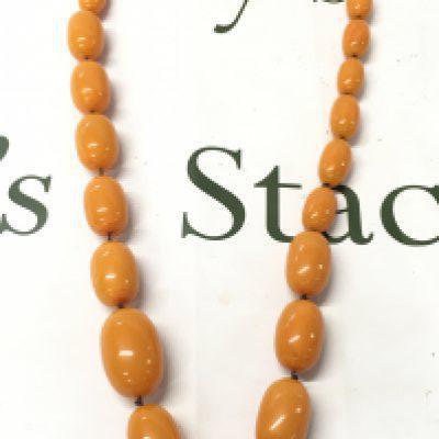 Large bakelite amber necklace , 94cm long , 290g total weight. Postage category A