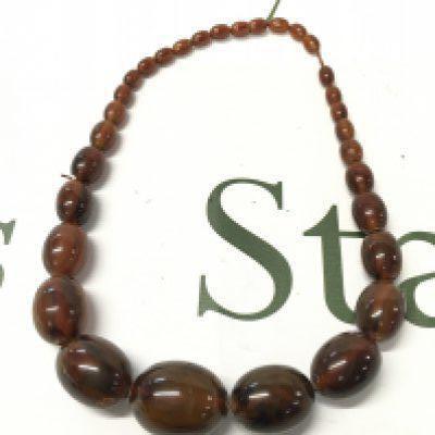 A bakelite amber necklace , 52cm long 80g Approx total weight. Postage cat A