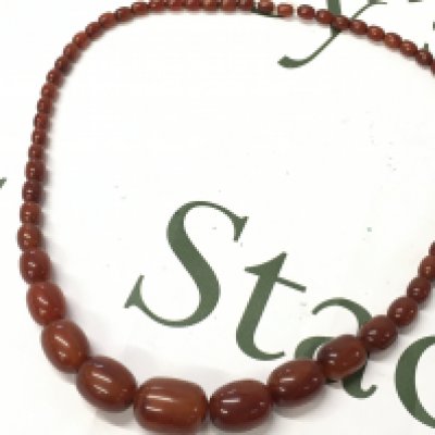 A bakelite cherry amber necklace, 70cm long . 70g total weight postage cat A
