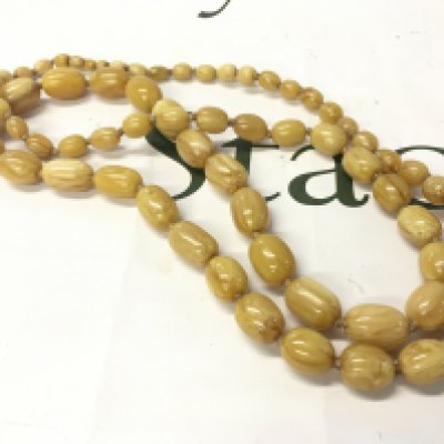 A butterscotch bakelite amber necklace , 120cm and 146g Approx weight Postage category A