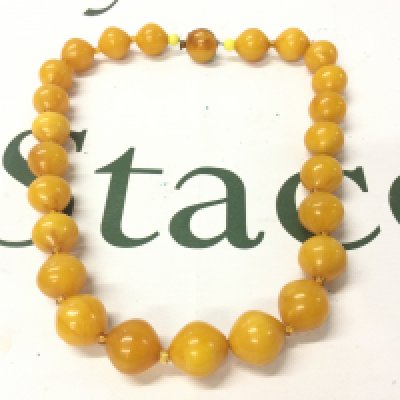 A butterscotch Bakelite amber necklace ,50cm long and 65g weight postage category A