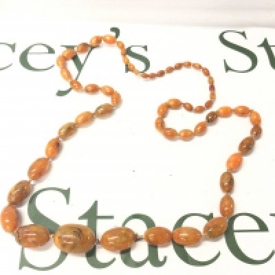 A Graduated Baltic Amber Necklace, 90cm and 60g weight