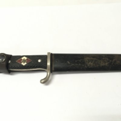 A Hitler Youth dagger with Solingen makers mark. Blut und Ehre inscription to blade. Blade 15cm long 26cm total length. Marked 1936.