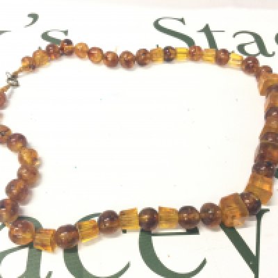 A Bakelite Amber Necklace, 30cm long. 75g. Postage category A