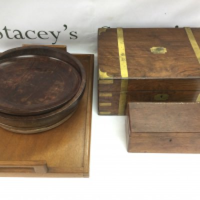 A brass bound writing slope, tea caddy, tray and four Kenyan carved wood dishes (7). Shipping category D.
