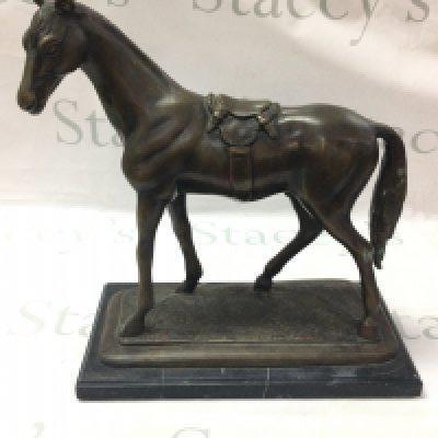 A bronze horse figure on a marble base ,34cm tall. Postage category C