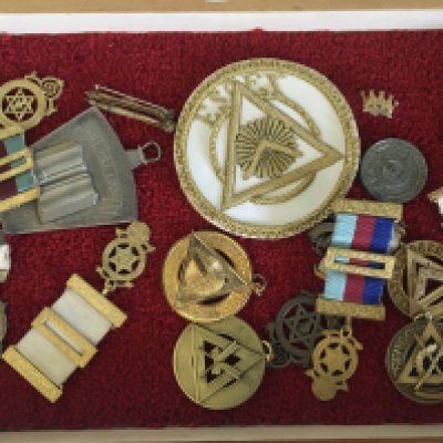 A collection of gilt metal Masonic Jewels a large collar Jewel Essex cloth badge and other associated items.- NO RESERVE