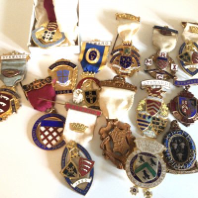 A collection of enamel and gilt metal Stewards Jewels several with the Essex Shield.- NO RESERVE