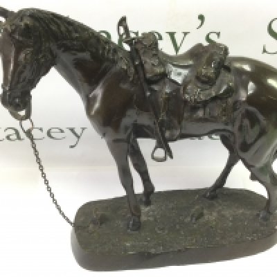 A 20th Century bronze figure of a military horse, approx height 41cm. Shipping category D.