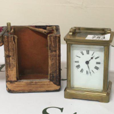 A brass cased carriage clock with key and case. Not seen working.
