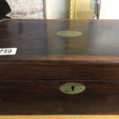 A mahogany brass bound writing slope with a fitted interior.