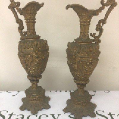 A pair of Victorian gold coloured spelter urns with perfuse decoration. Height 46cm