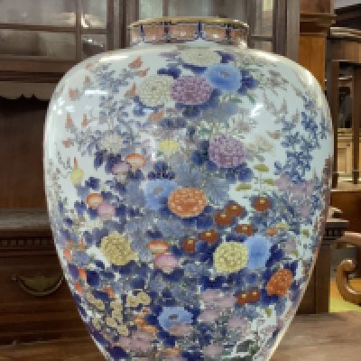 A good Koransha porcelain vase, c. 1880, the body painted in underglaze blue, Oranges, yellows and gilding to the chrysanthemums and foliage, underglaze blue signature, 40cm