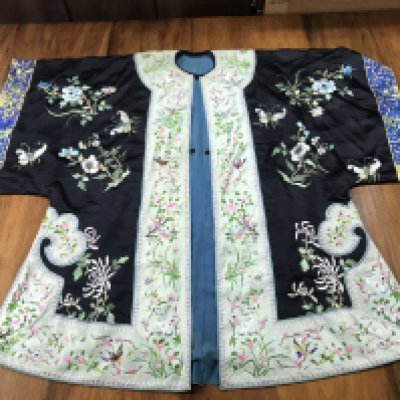 A Chinese embroidered silk robe . Postage category B