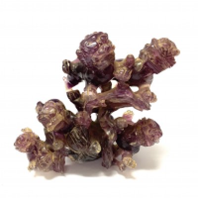 A carved Amythst rock crystal groups of lion dogs. 12cm.