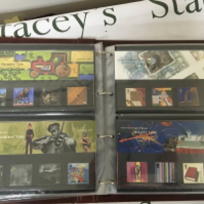 Seven albums of presentation packs including a few coin covers and high value unused Elizabeth II stamps well presented. (7)