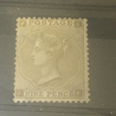 An unused 1862 Victorian nine pence stamp an unused Victorian six pence stamp and a block of two George V one penny stamps