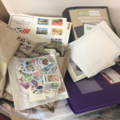 A box containing first day covers playing cards a few presentation packs and albums containing post office picture cards PHQ.
