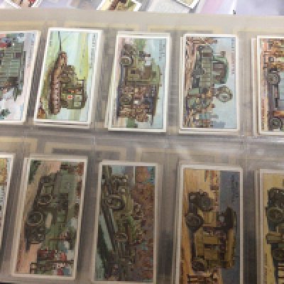 Five albums containing vintage cigarette cards and other collectors cards. Including Barrett football cards Space 1999 Bassett World Cup 74 cards The Conquest of Space 1980-81 Disney cards Vintage Adkin War Trophies Wills Military Motors and numerous others.