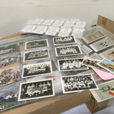 A box containing a good selection of vintage cigarette cards including Spped through the ages Wills Military motors British Livestock Vintage Chums football teams and numerous others and some postcards.