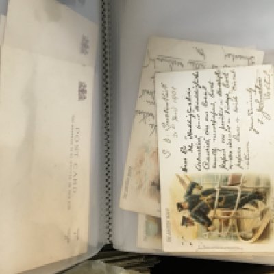 A box containing a quantity of albums of Vintage postcards approximately twelve albums and some loose cards.