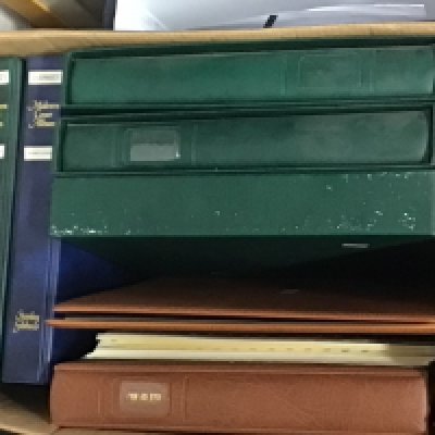 A box containing stamp albums. Including Many unused pictorial stamps Isle of Man Jersey Guernsey and others.