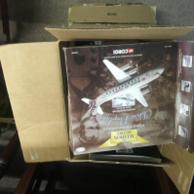 Two boxes containing Aircraft memorabilia books Aviation Aircraft models Civil airplanes badges and other oddments. (2)